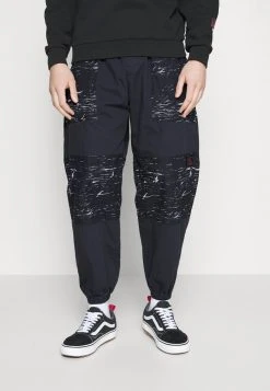 Hot Sale ✔️ Quiksilver STRANGER THINGS SKULL ROCK PANT - Tracksuit Bottoms - Black ✔️